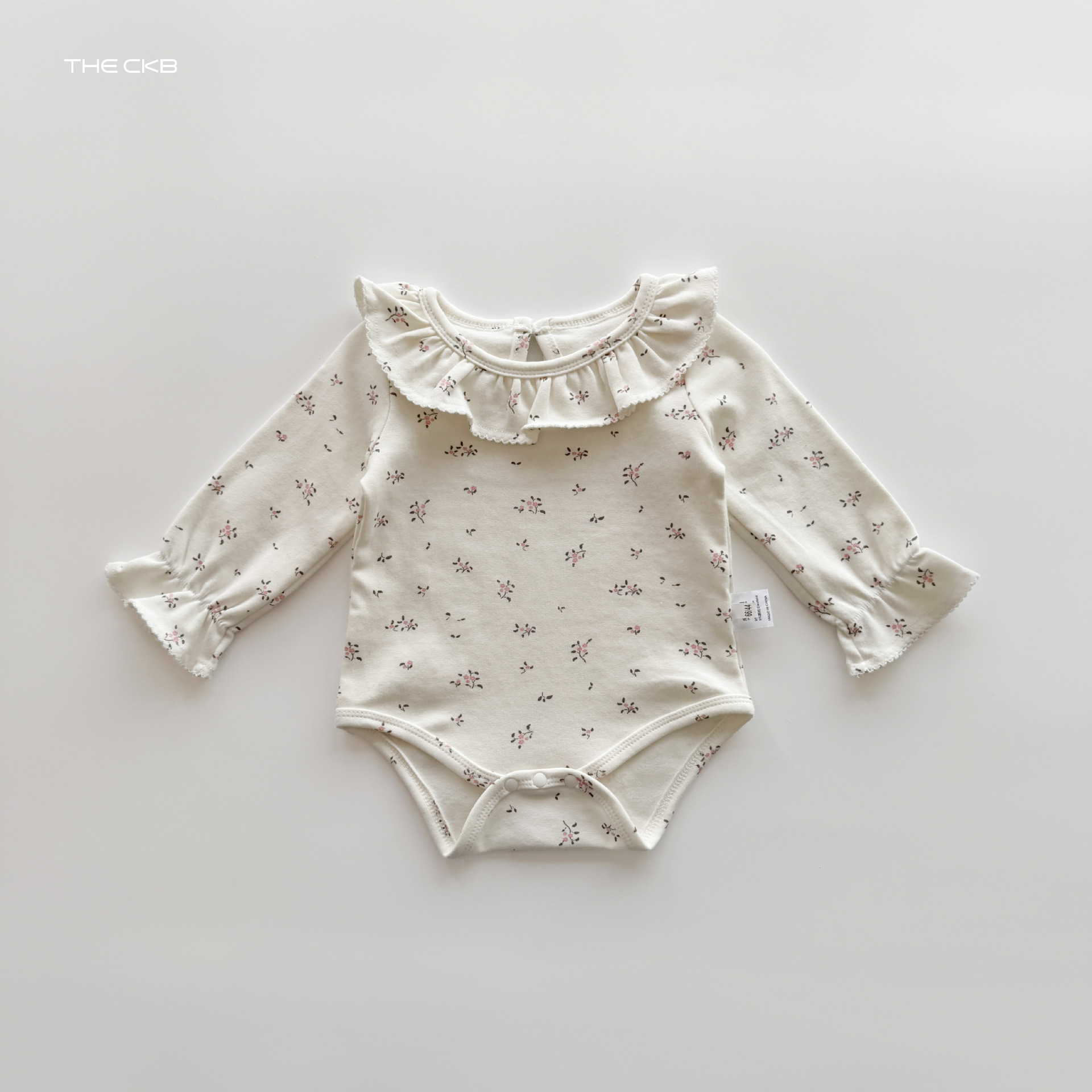 ナチュラルフリル ロンパース