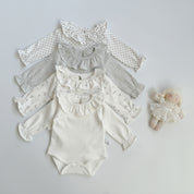 ナチュラルフリル ロンパース
