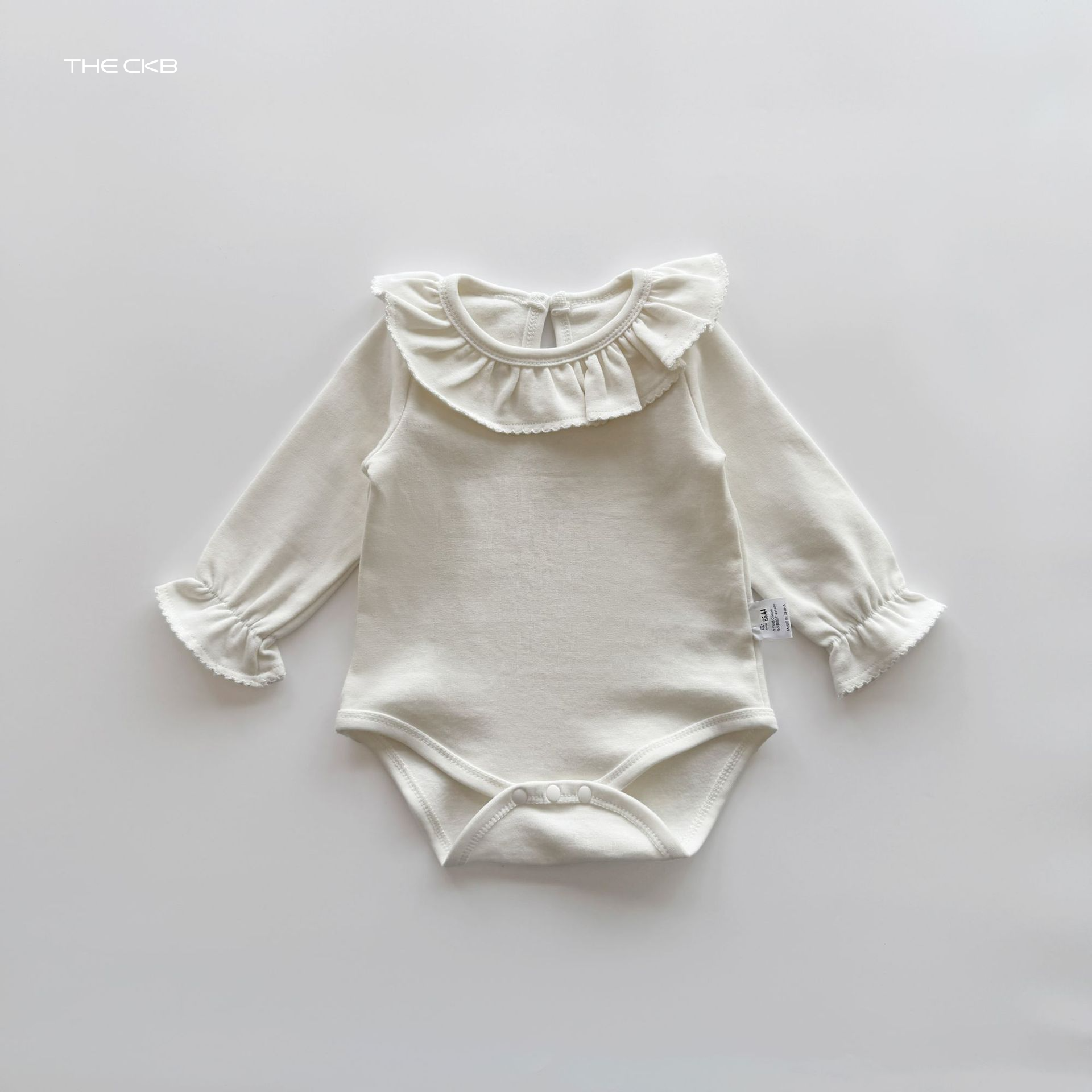 ナチュラルフリル ロンパース