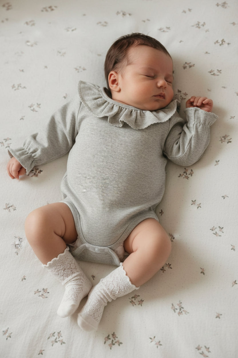 ナチュラルフリル ロンパース